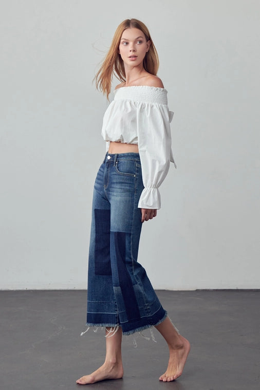 The West Mid Rise Raw Patched Cropped Jean